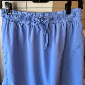 Two Beyond Yoga Light Blue Athletic tennis skirts with compression shorts.